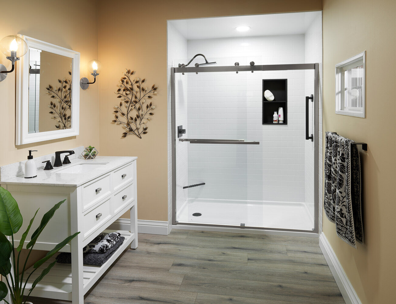 Bathroom remodel featuring white subway tiles and oil-rubbed bronze fixtures by Quick Bath Solutions in Fresno